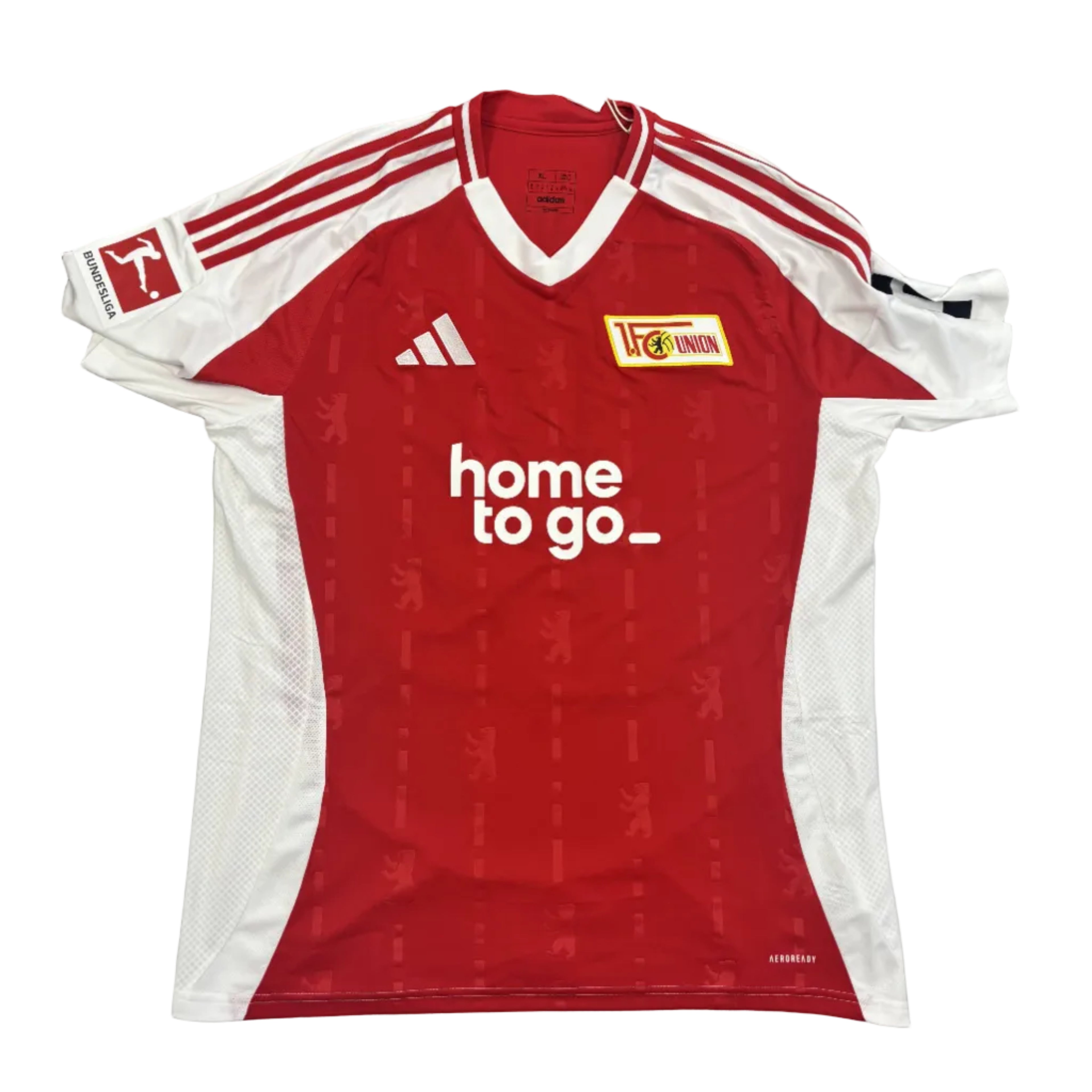 Red sports jersey with white accents on a gray surface