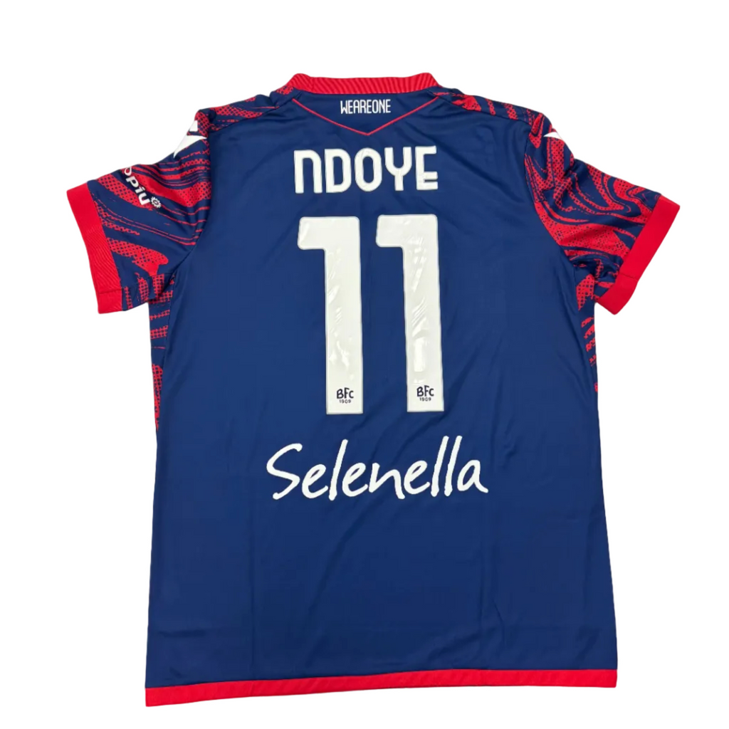 Blue sports jersey with red accents on a round white table