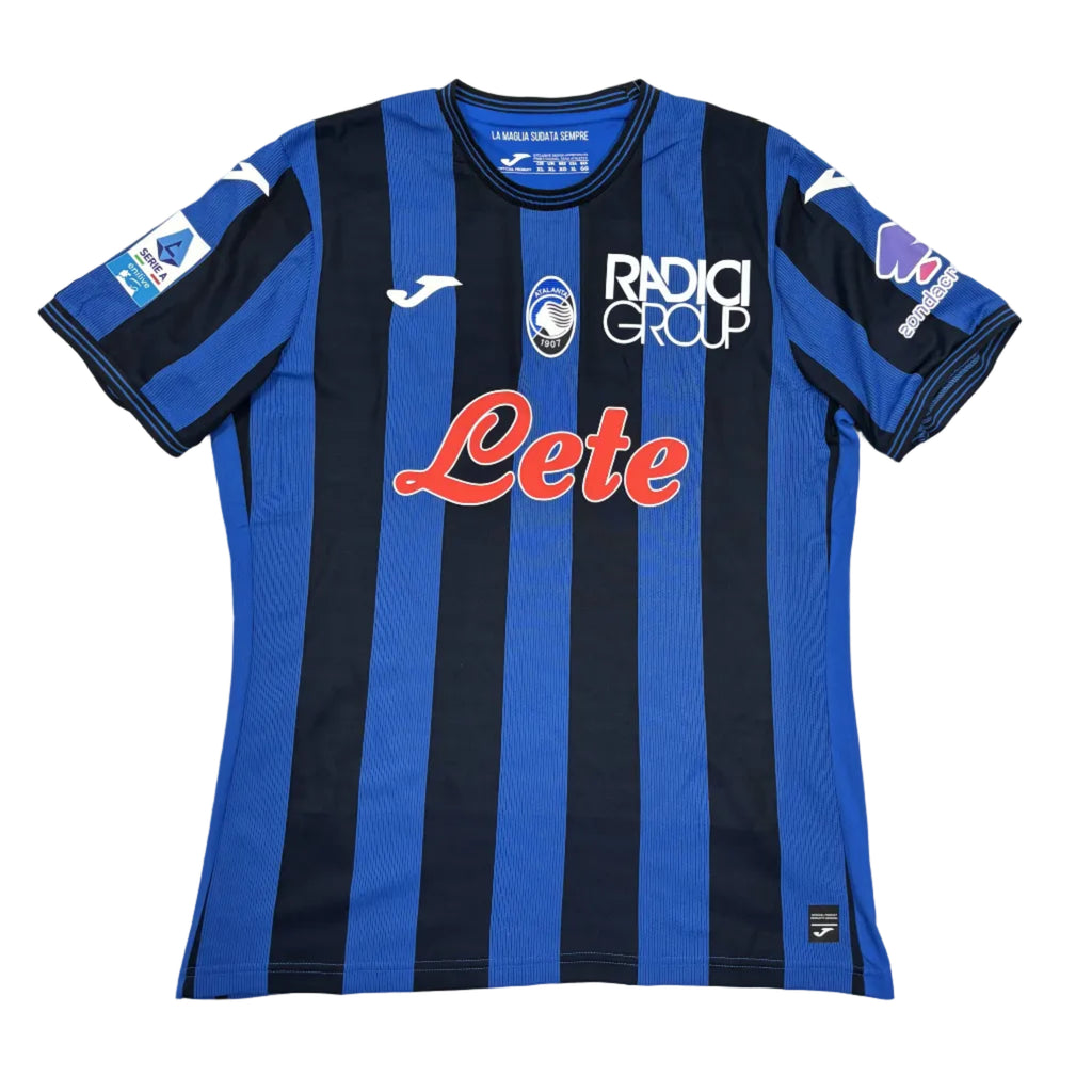 Blue and black striped sports jersey with visible branding on a white surface