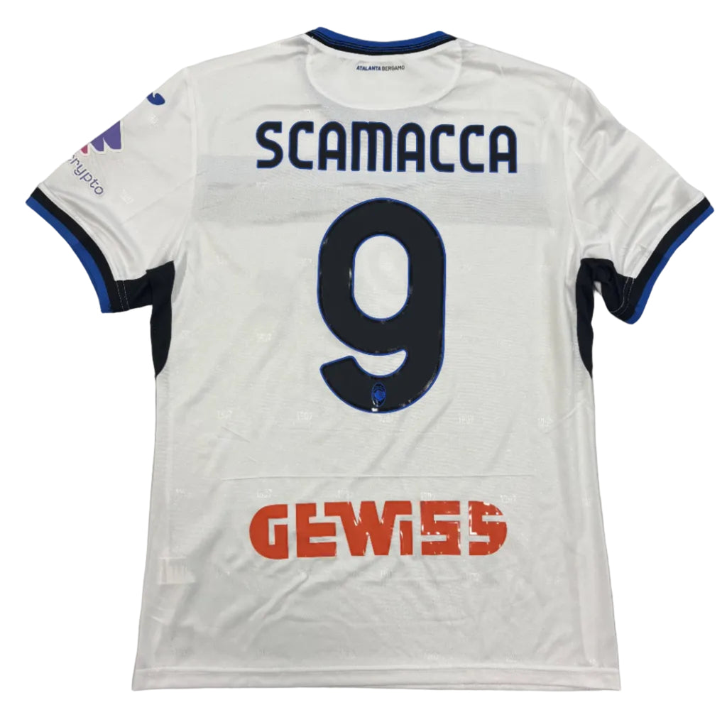White sports jersey with 'SCAMACCA 9' and 'GEWISS' branding on a gray background