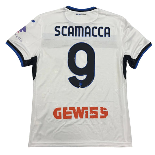 White sports jersey with 'SCAMACCA 9' and 'GEWISS' branding on a gray background