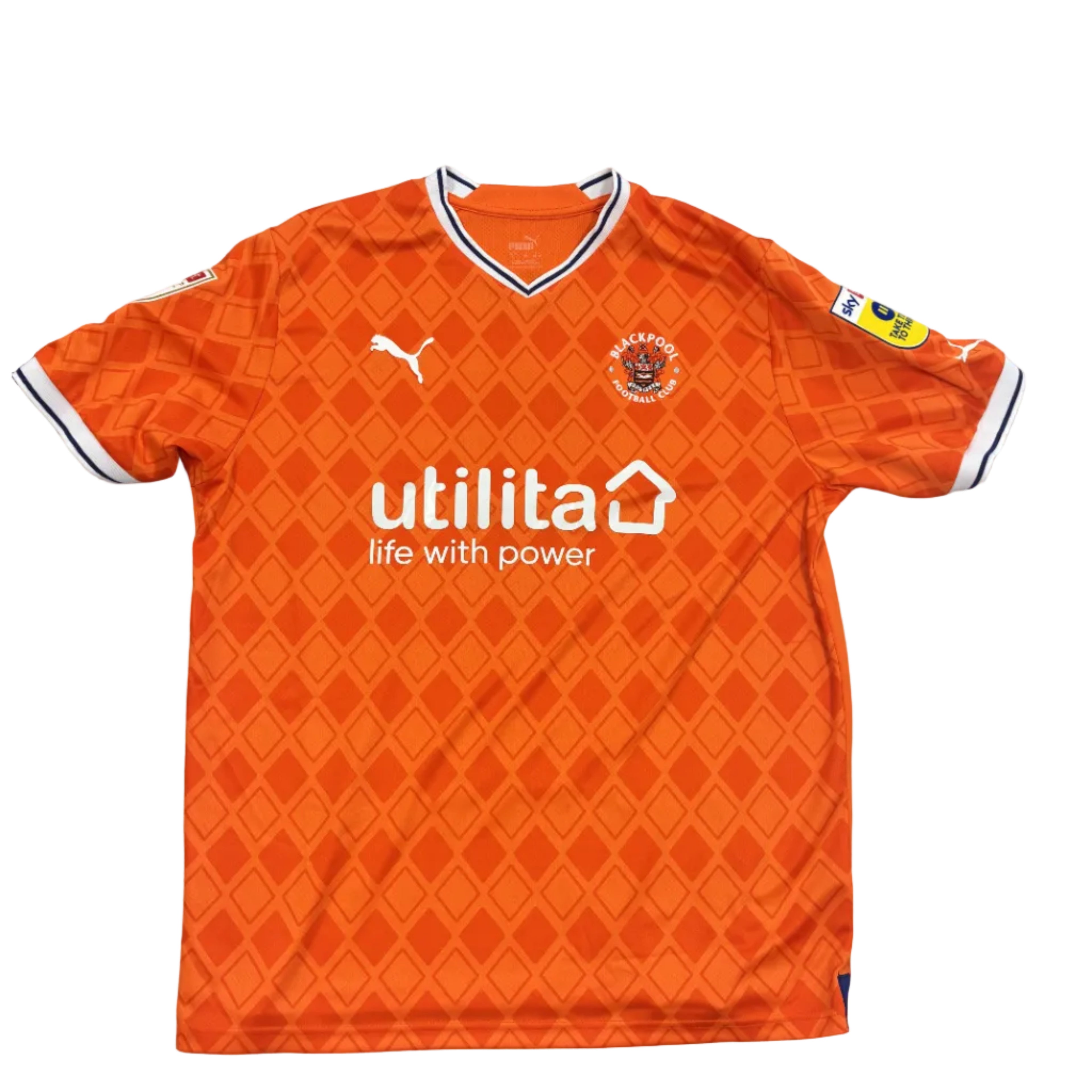 Orange sports jersey with branding on a gray surface