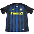 Black and blue sports jersey with Pirelli logo on a round white table.