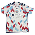 Soccer jersey with geometric pattern on a gray surface
