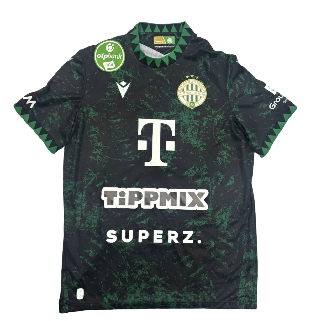 Black sports jersey with green patterns on a round white table