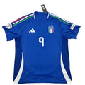 Blue soccer jersey with number 9 on a white surface