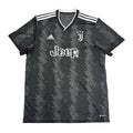 Black sports jersey with Jeep logo on a round white table