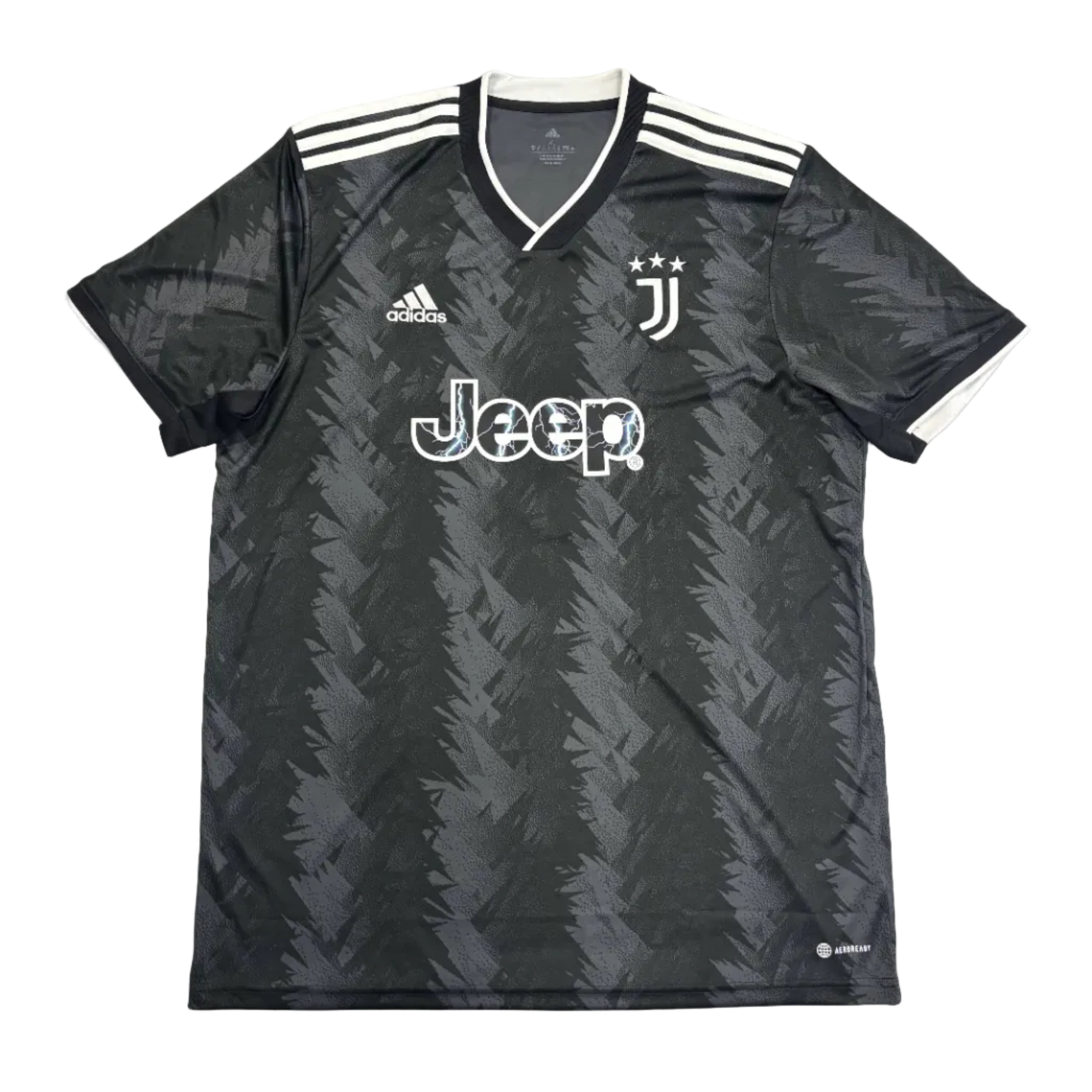 Black sports jersey with Jeep logo on a round white table