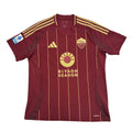 Maroon sports jersey with gold accents on a white surface, featuring 'Riyadh Season' text.