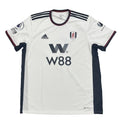 White sports jersey with black accents and branding on a round surface.