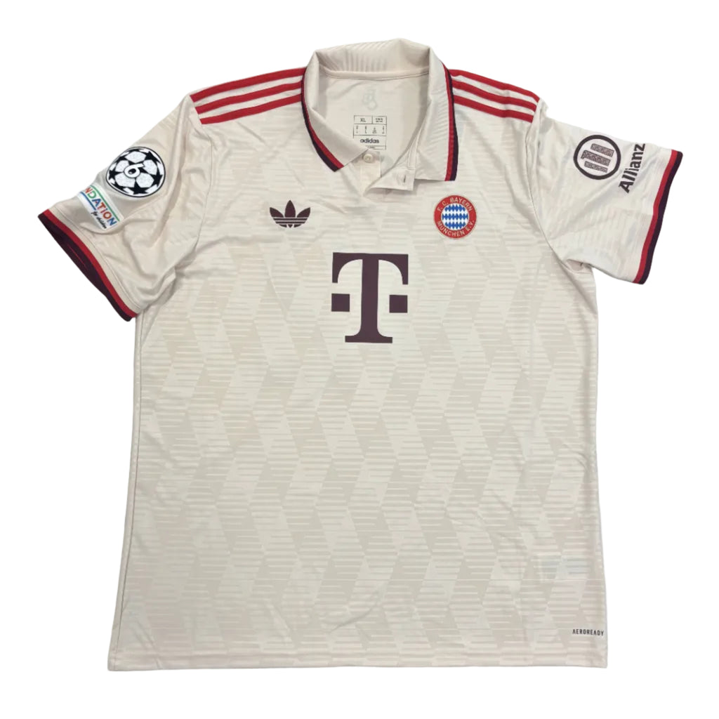 Beige sports jersey with red accents on a gray surface