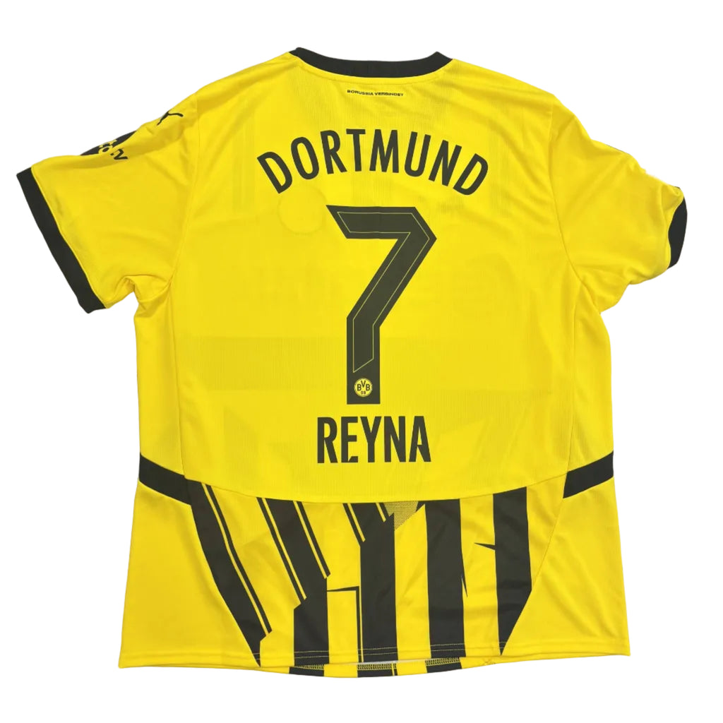 Yellow sports jersey with 'Dortmund' and 'Reyna' printed on a gray surface
