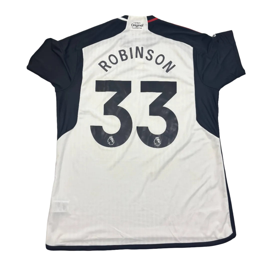White sports jersey with black sleeves and 'Robinson 33' printed on a round white table.