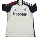 White sports jersey with black and red accents on a gray surface