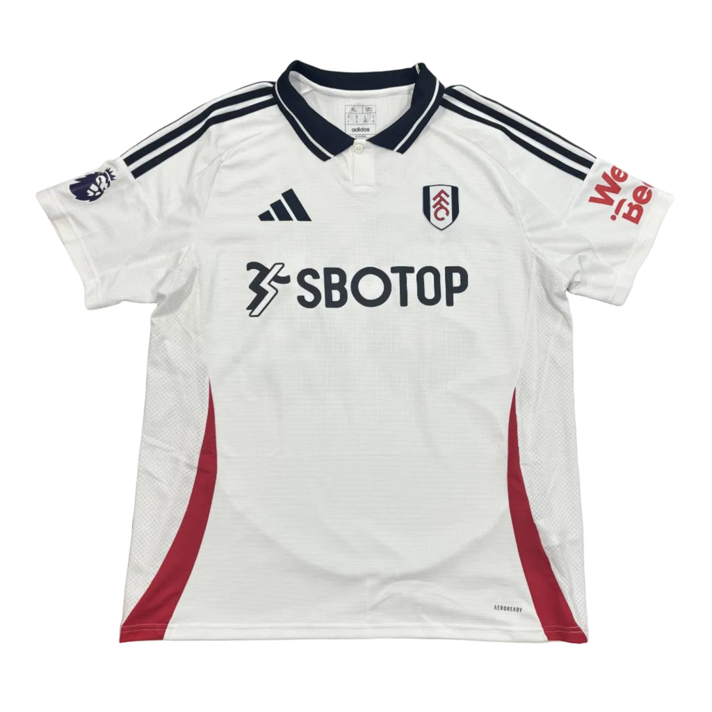 White sports jersey with red accents and visible branding on a round surface.