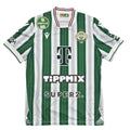 Green and white striped sports jersey on a round table