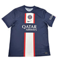 Blue sports jersey with Qatar Airways logo on a white surface