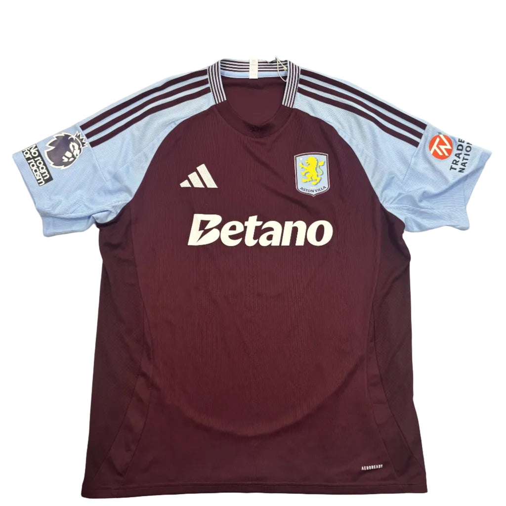 Maroon sports jersey with visible branding on a round surface