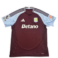 Maroon sports jersey with visible branding on a round surface